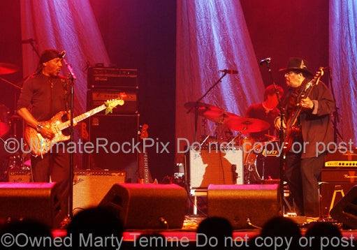 Photo of Jimi Hendrix alumni Ernie Isley and Billy Cox in performing together in concert by Marty Temme