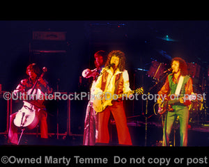 Photo of Hugh McDowell, Jeff Lynne and Kelly Groucutt of ELO in 1975 by Marty Temme