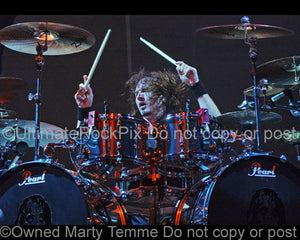 Photo of drummer Eric Singer of Kiss and Alice Cooper in concert by Marty Temme