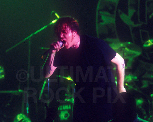 Photo of Burton Bell of Fear Factory singing in concert in 1998 by Marty Temme
