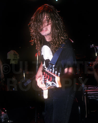 Photo of Troy Gregory of Flotsam and Jetsam in concert in 1988 by Marty Temme