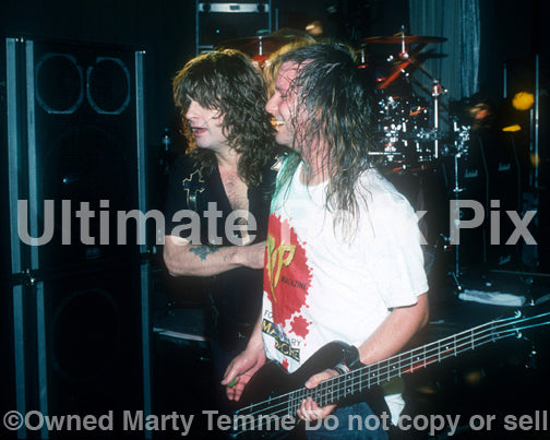 Photo of Billy Gould of Faith No More and Ozzy Osbourne in concert in 1991 by Marty Temme