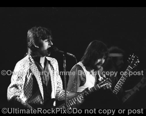 Photo of Dave Peverett and Rod Price of Foghat in concert in 1980 by Marty Temme