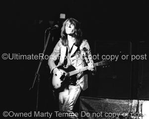 Photo of Dave Peverett of Foghat in concert in 1973 by Marty Temme