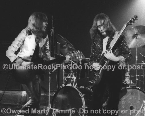 Photo of Dave Peverett and Rod Price of Foghat in concert in 1973 by Marty Temme