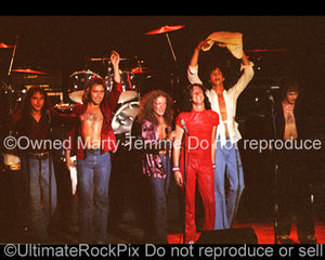 Photo of Lou Gramm and Foreigner in concert in 1977 by Marty Temme