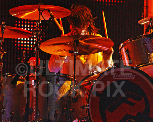 Photo of drummer Jason Sutter of Foreigner and Chris Cornell in concert by Marty Temme