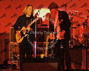 Photo of G.E. Smith and Billy Gibbons playing together in concert by Marty Temme