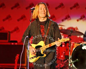 Photo of G.E. Smith playing a Telecaster in concert by Marty Temme