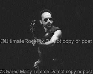 Photos of Mel Schacher of Grand Funk Railroad in Concert Performing in 1999 by Marty Temme