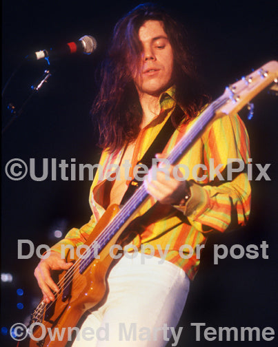 Photo of bass player Mike Szuter of Paul Gilbert in concert in 1998 by Marty Temme