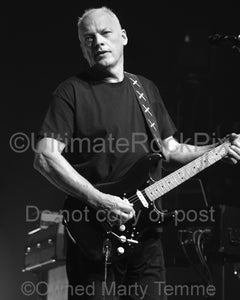 Black and white photo of David Gilmour playing his Fender Stratocaster in concert by Marty Temme
