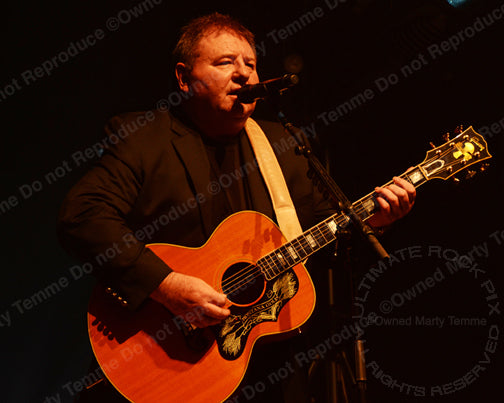 Photo of Greg Lake of Emerson, Lake & Palmer in concert in 2012 by Marty Temme