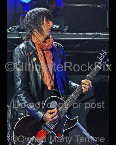 Photo of Richard Fortus of Guns N' Roses playing a Gibson hollowbody guitar by Marty Temme