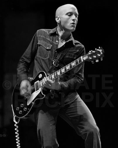 Black and white photo of Michael Ward of Ben Harper playing a Les Paul in concert by Marty Temme