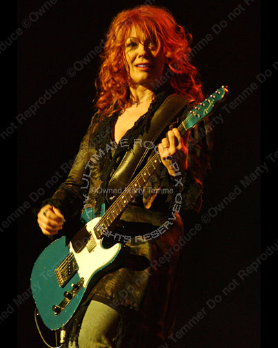 Photo of Nancy Wilson of Heart in concert in 2007 by Marty Temme