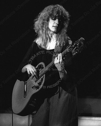 Photo of guitar player Nancy Wilson of Heart in concert in 1980 by Marty Temme