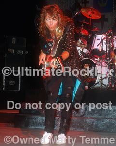 Photo of Chuck Wright of House of Lords in concert in 1989 by Marty Temme