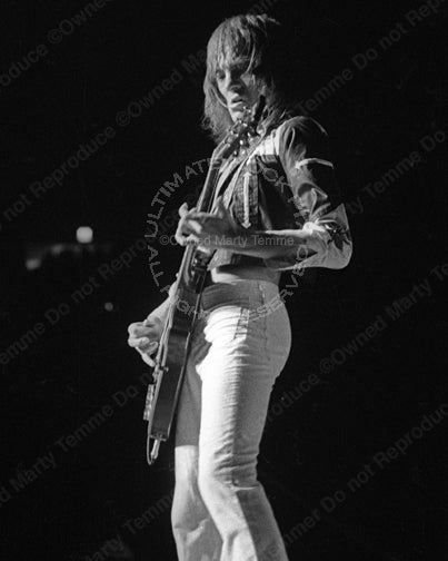 Photo of Steve Marriott of Humble Pie playing a Gibson Les Paul in concert in 1973 by Marty Temme