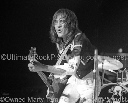 Photo of Steve Marriott of Humble Pie playing a Gibson Les Paul in concert in 1973 by Marty Temme