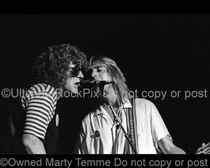 Photo of Ian Hunter and Mick Ronson in concert in 1979 by Marty Temme