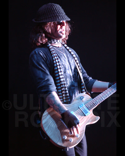 Photo of Paul Spatola of the band Hurt in concert in 2006 by Marty Temme