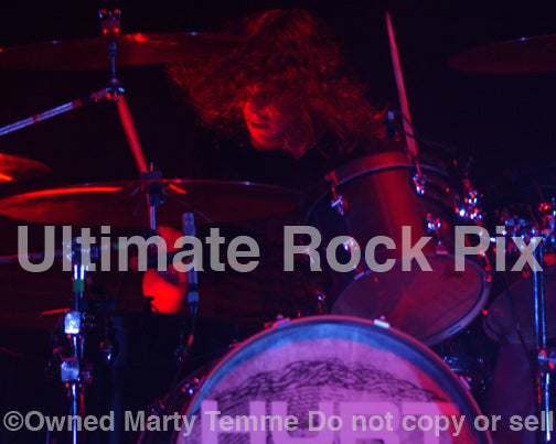 Photo of drummer Evan Johns performing with the band Hurt in concert in 2006 by Marty Temme
