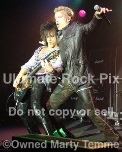 Photo of Billy Idol and Steve Stevens in concert in 2005 by Marty Temme