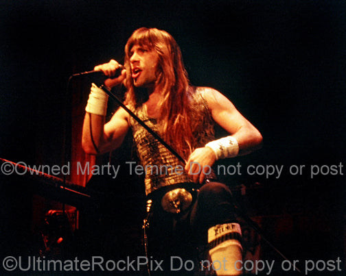 Photo of Bruce Dickinson of Iron Maiden in concert in 1985 by Marty Temme