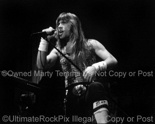 Black and white photo of Bruce Dickinson of Iron Maiden in concert in 1985 by Marty Temme