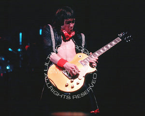 Photo of Adrian Smith of Iron Maiden playing a Les Paul in concert in 1985 by Marty Temme
