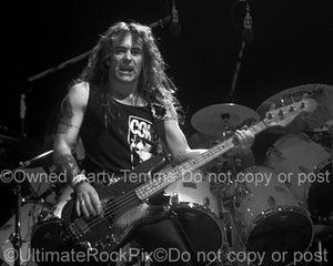Black and white photo of Steve Harris of Iron Maiden in concert in 1991 by Marty Temme