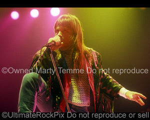 Photo of Bruce Dickinson of Iron Maiden singing in concert in 1991 by Marty Temme