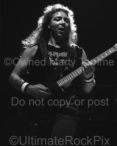 Black and white photo of guitarist Dave Murray of Iron Maiden in concert in 1991 by Marty Temme