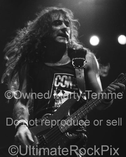 Black and white photo of Steve Harris of Iron Maiden onstage in 1991 by Marty Temme