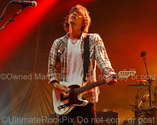 Photo of Brandon Boyd of Incubus playing a Telecaster in concert by Marty Temme