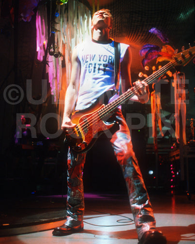 Photo of bassist Martyn LeNoble of Janes Addiction in concert in 2001 by Marty Temme