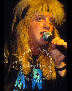 Photo of Jani Lane of Warrant performing in concert in 1989 by Marty Temme