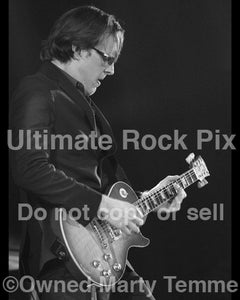Black and white photo of Joe Bonamassa playing a Les Paul in concert by Marty Temme