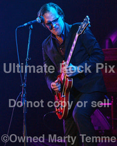 Photo of Joe Bonamassa playing a Gibson hollowbody in concert by Marty Temme