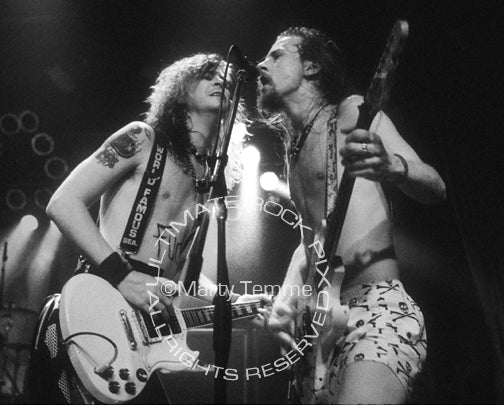 Black and white photo of Duff McKagan of Guns N' Roses and Jerry Cantrell of Alice in Chains in concert in 1991 by Marty Temme