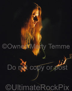 Photo of Jerry Cantrell of Alice In Chains playing an acoustic guitar by Marty Temme