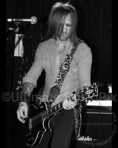 Black and white photo of guitarist Billy Rowe of Jetboy in concert in 2009 by Marty Temme