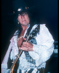 Photo of guitarist Nasty Suicide of Hanoi Rocks onstage with Jetboy in 1988 by Marty Temme