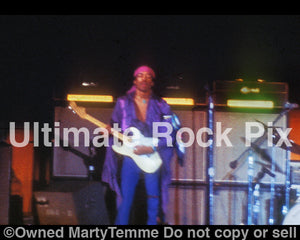 Photo of guitarist Jimi Hendrix performing in concert in 1969 by Marty Temme