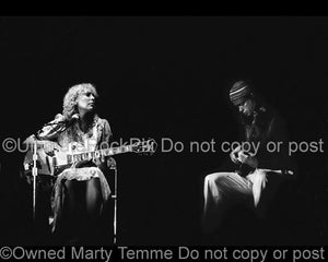 Black and White Photos of Joni Mitchell Playing an Ibanez Guitar with Bassist Jaco Pastorious in Concert in 1979 by Marty Temme
