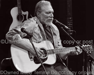 Black and white photo of Jorma Kaukonen in concert in 2010 by Marty Temme