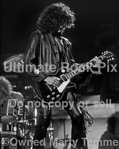 Black and white photo of Joe Perry playing a Les Paul in 1990 by Marty Temme