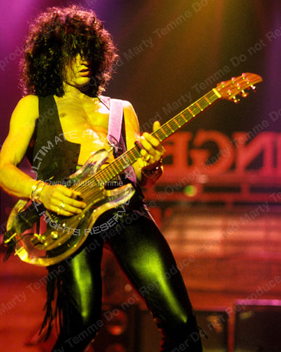 Photo of guitar player Joe Perry in concert in 1990 by Marty Temme