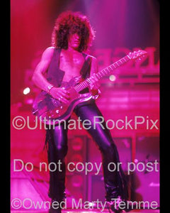 Photo of guitar player Joe Perry playing slide by Marty Temme